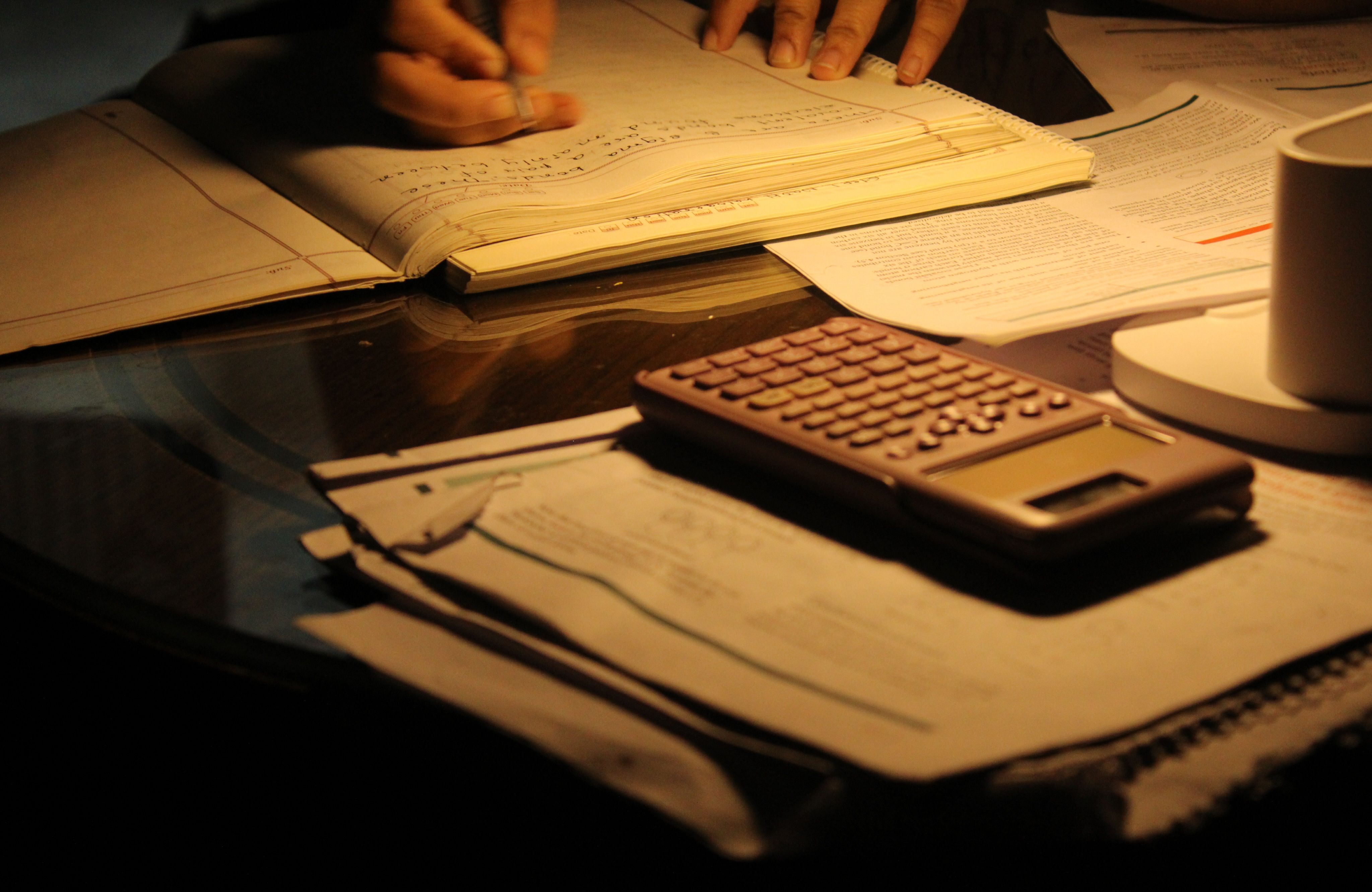 A student-athlete doing homework late at night
